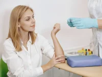 skillful-nurse-is-doing-blood-test-woman-clinic-gilr-sitting-near-table-scaled-1
